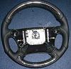 Custom leather steering wheel wraps now available!-saab-carbon-wheel.jpg
