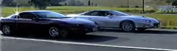 Watch a LT1 Camaro Racing Versus a LS1 Camaro