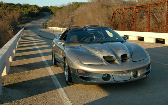 RIDE ON! A 1999 Pewter Trans Am in the Garage