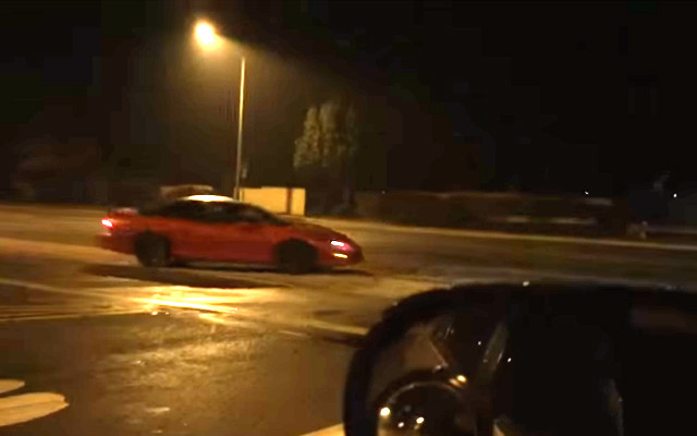 Two Camaros Spin Donuts in the Street