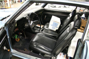 Interior of original 1969 Chevy with black vinyl before restoration
